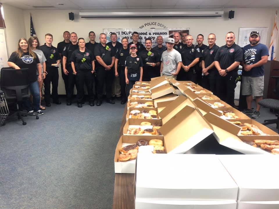 Blue Ash police officers with Tyler Carach and his gift of donuts